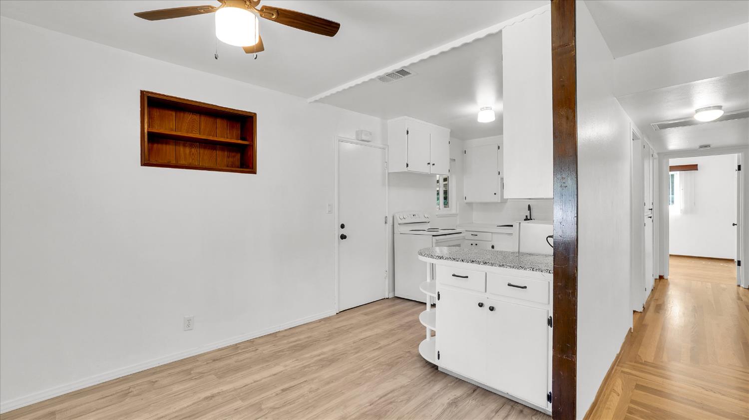 3543 Tarro Way Carmichael, CA 95608 - Photo 11 of 42 a view of hallway with chandelier and wooden floor