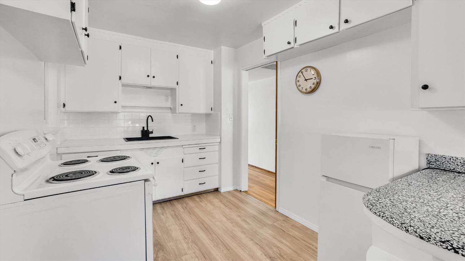 3543 Tarro Way Carmichael, CA 95608 - Photo 13 of 42 a kitchen with white cabinets and white appliances