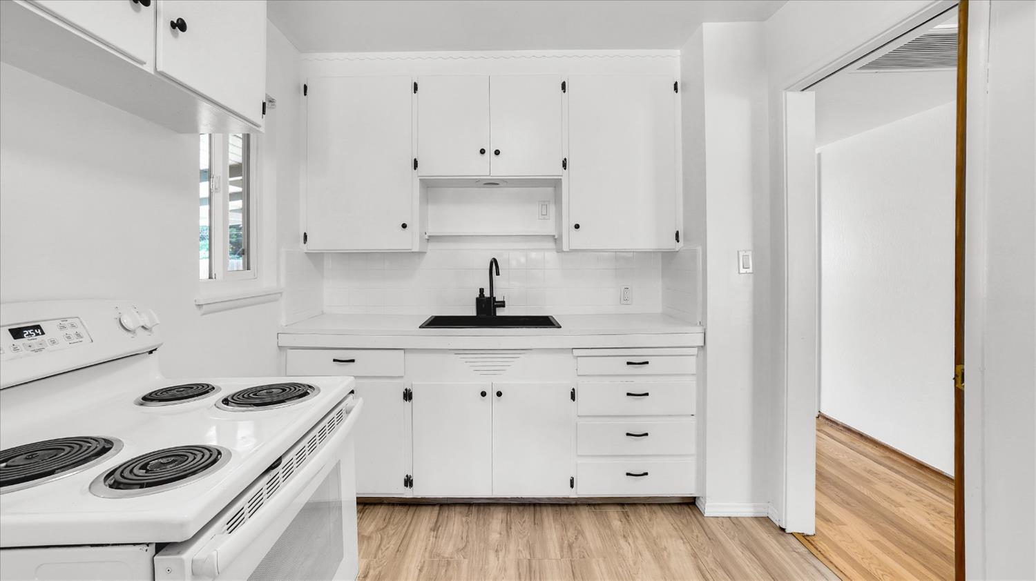 3543 Tarro Way Carmichael, CA 95608 - Photo 14 of 42 a kitchen with cabinets appliances and a window
