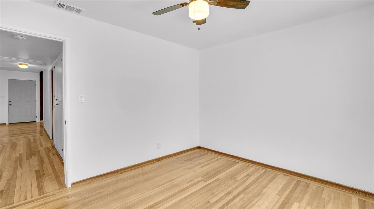 3543 Tarro Way Carmichael, CA 95608 - Photo 19 of 42 a view of a room with wooden floor and white walls