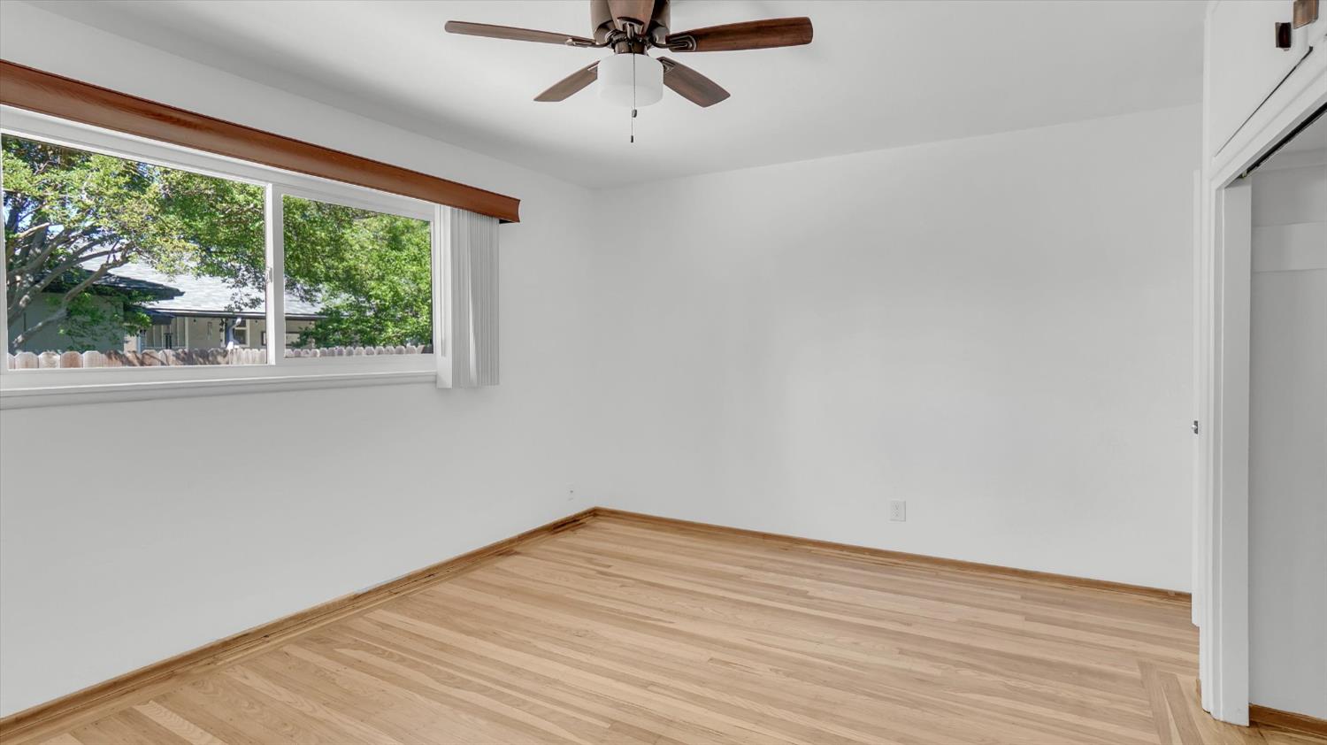 3543 Tarro Way Carmichael, CA 95608 - Photo 21 of 42 wooden floor in an empty room with a window