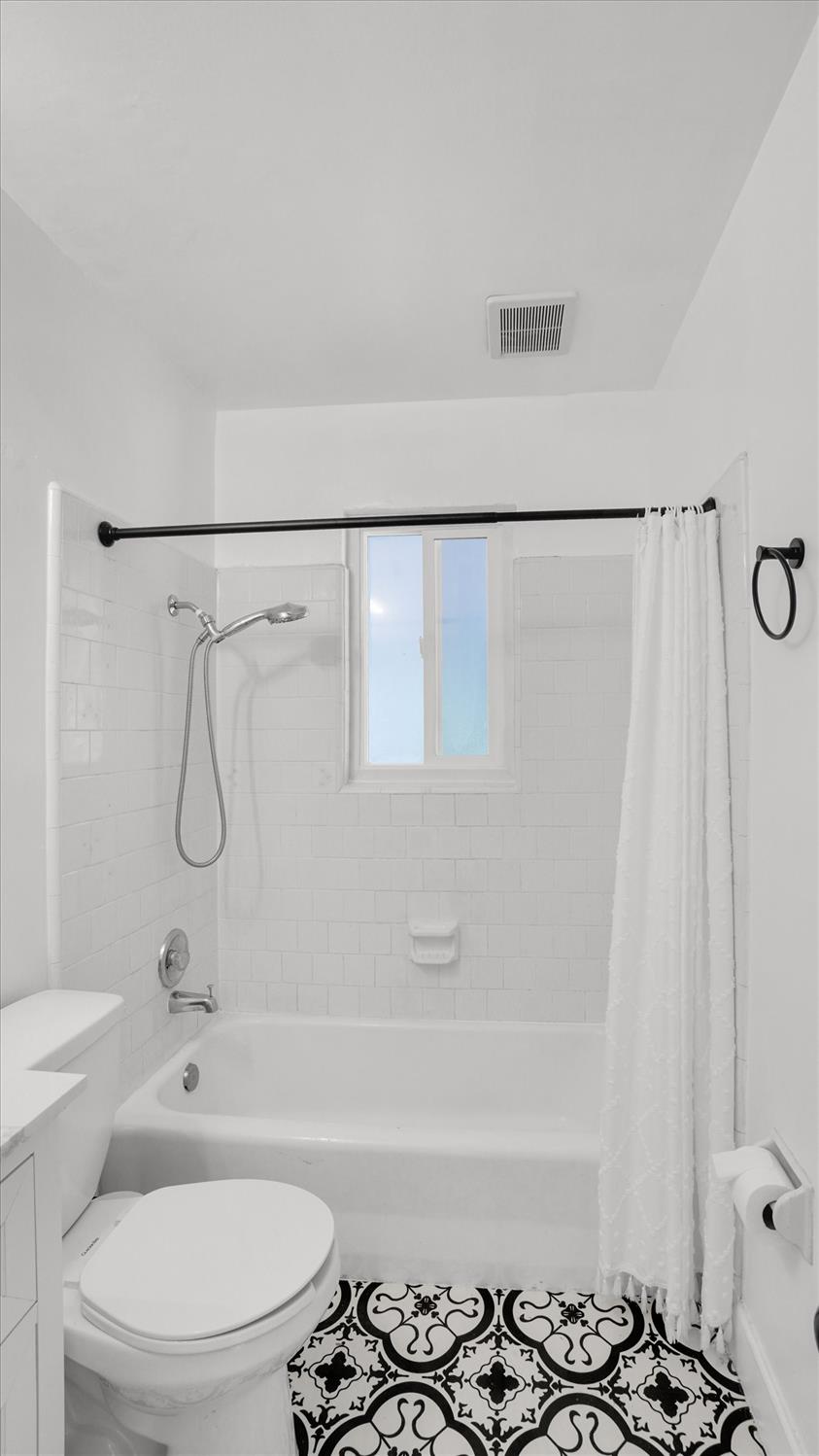 3543 Tarro Way Carmichael, CA 95608 - Photo 25 of 42 a bathroom with a granite countertop bathtub shower sink and toilet