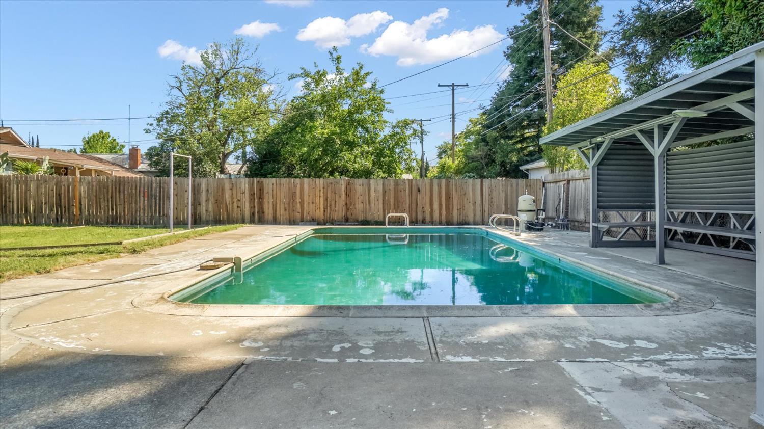 3543 Tarro Way Carmichael, CA 95608 - Photo 31 of 42 a view of backyard with table and chairs and wooden fence