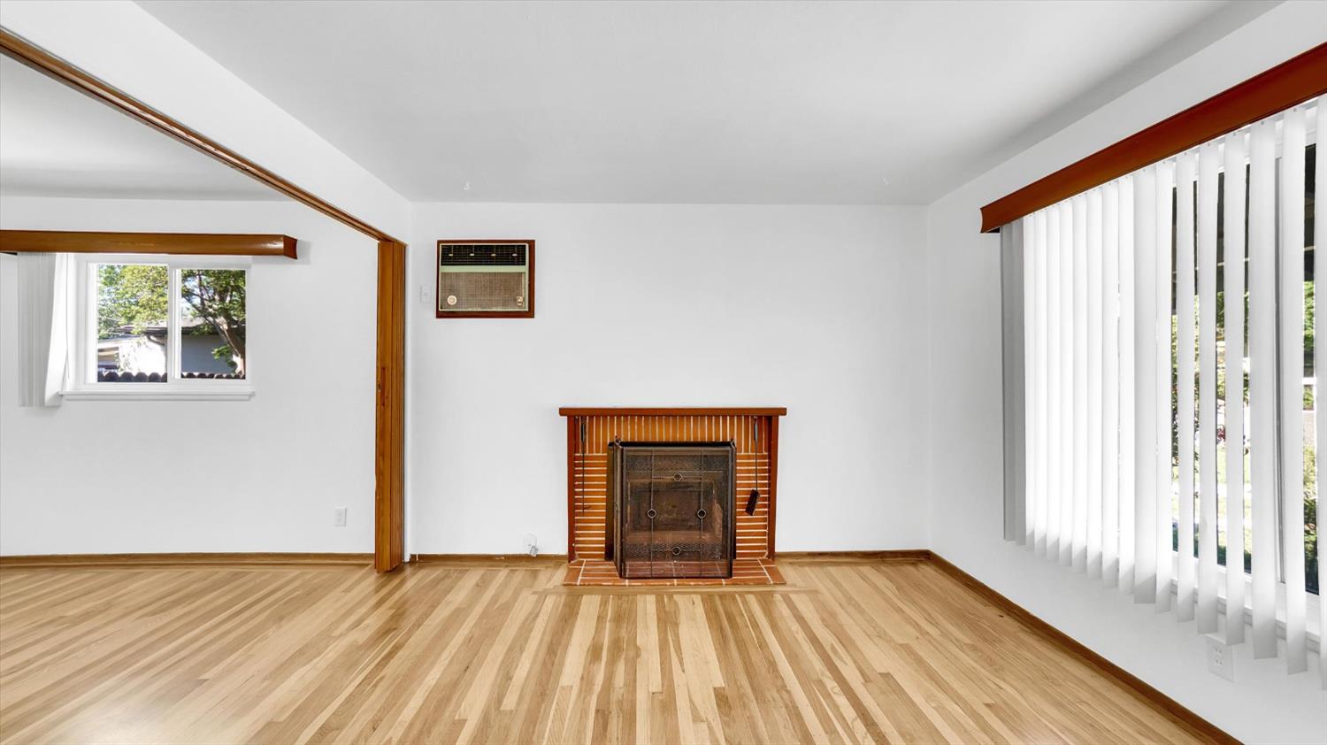 3543 Tarro Way Carmichael, CA 95608 - Photo 5 of 42 a view of an empty room with wooden floor and a window
