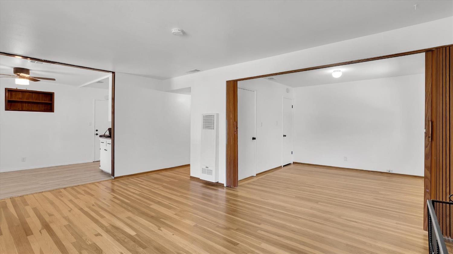 3543 Tarro Way Carmichael, CA 95608 - Photo 6 of 42 an empty room with wooden floor and windows