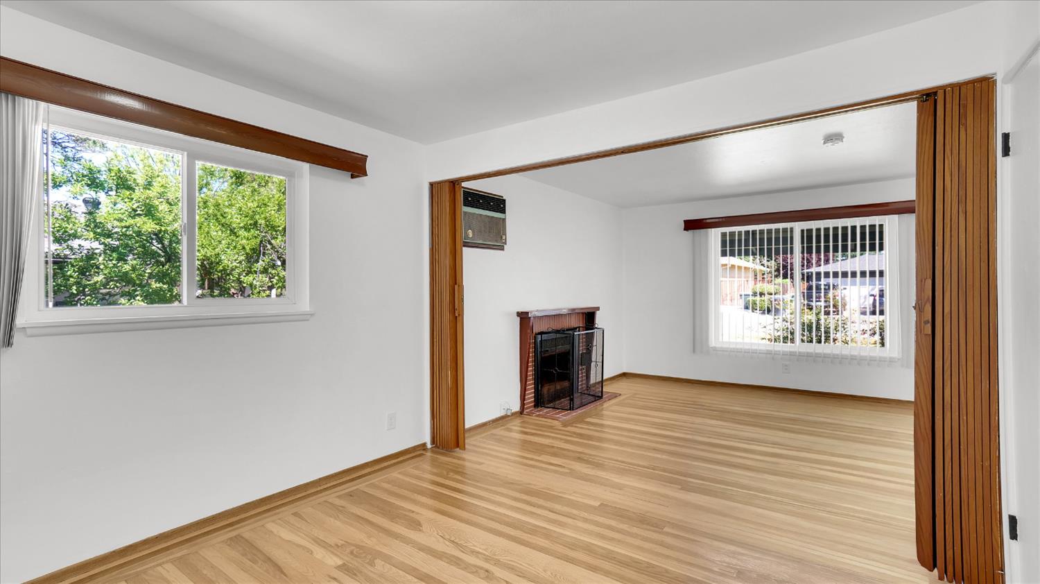 3543 Tarro Way Carmichael, CA 95608 - Photo 8 of 42 a view of an empty room with a window and wooden floor