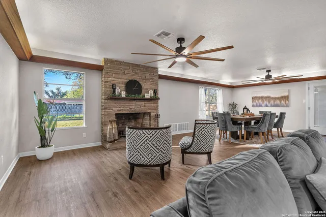 a living room with furniture and a fireplace