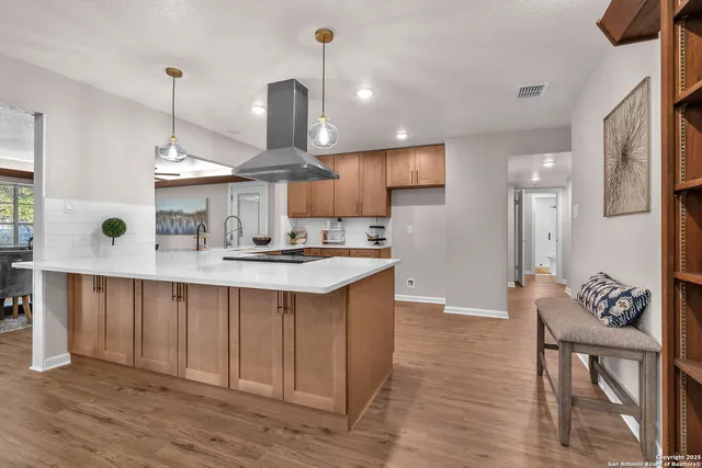 a kitchen with a stove and a sink