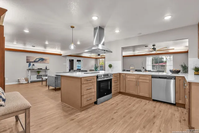 a kitchen with a stove and a sink