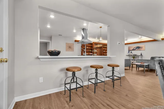 a kitchen with stainless steel appliances a sink a stove and a refrigerator