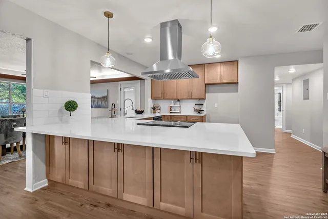 a stove top oven sitting inside of a kitchen