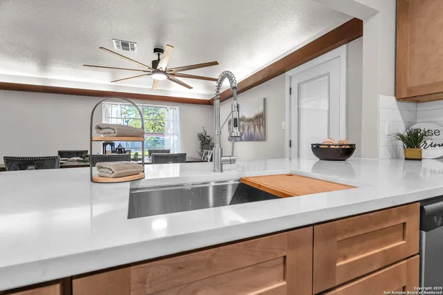 a spacious bedroom with a bed and window