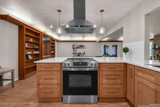 a bathroom with a granite countertop sink toilet a mirror a vanity and shower
