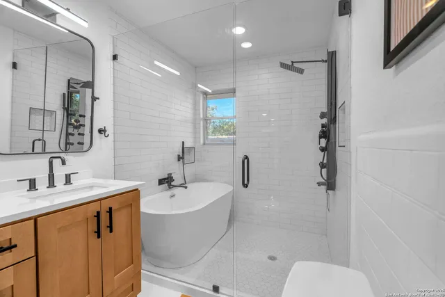 a bathroom with a sink a vanity and a mirror