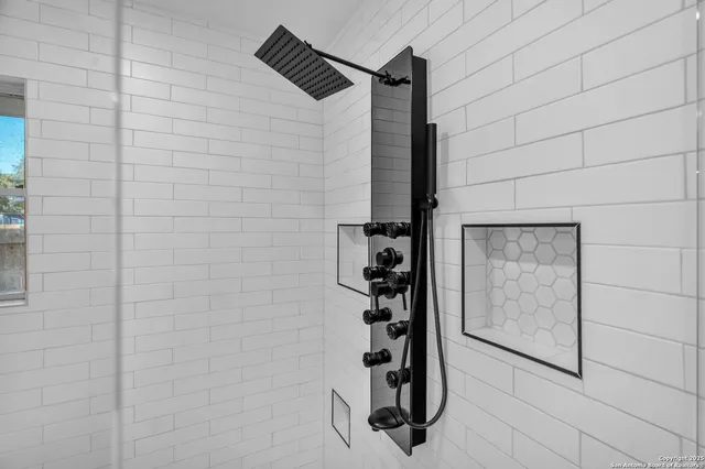 a bathroom with a sink a vanity and a mirror