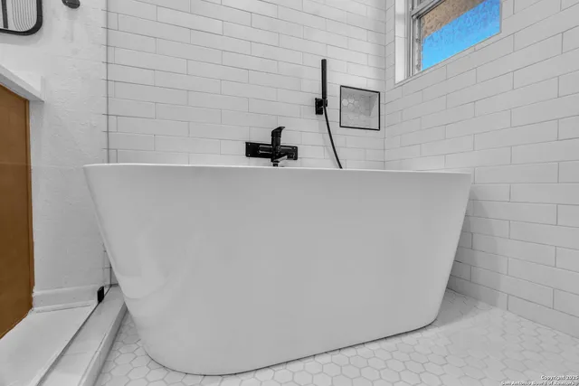 a view of a livingroom with furniture and front door