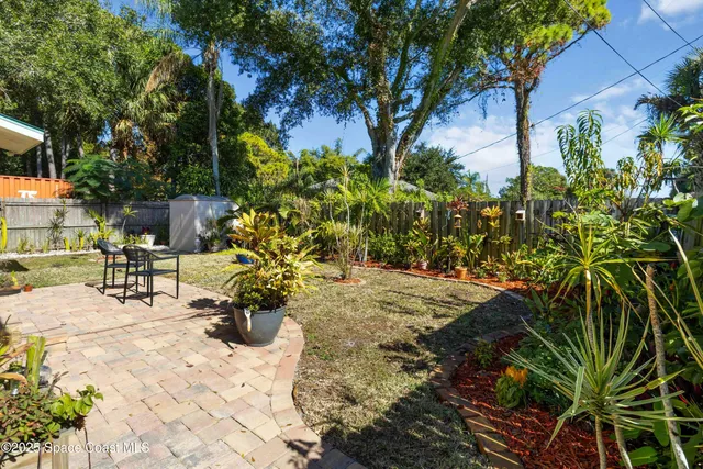 a view of a backyard of the house