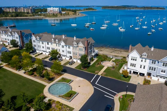 an aerial view of a house with a ocean view