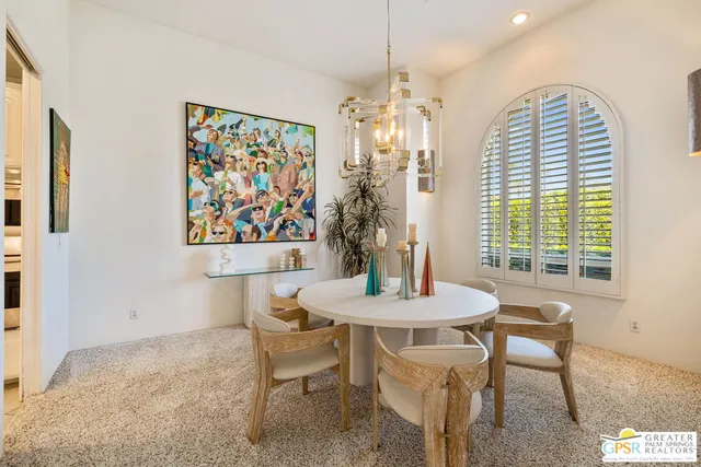 a large kitchen with stainless steel appliances kitchen island granite countertop a refrigerator a oven a sink and a stove