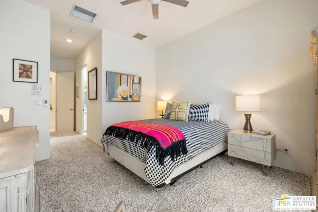 a living room with furniture and a chair