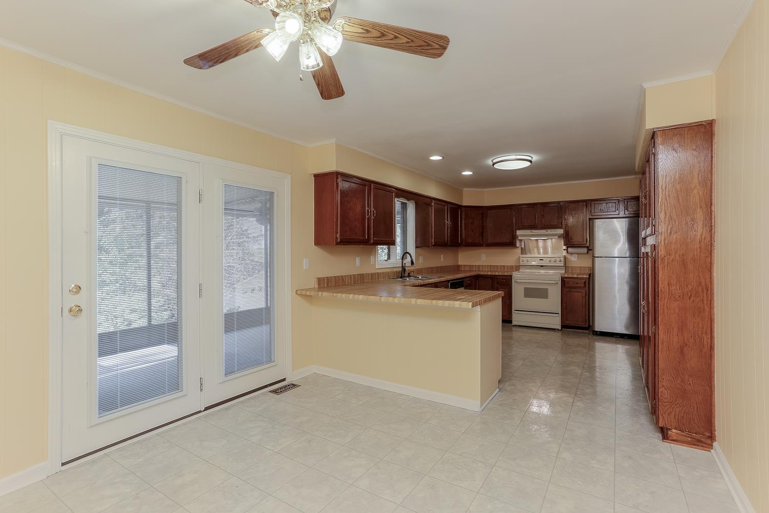 2162 Liebengood Road Goodlettsville, TN 37072 - Photo 15 of 29 Sitting/Eat In area off of Kitchen and Dining Room. French doors lead to large screened in deck.