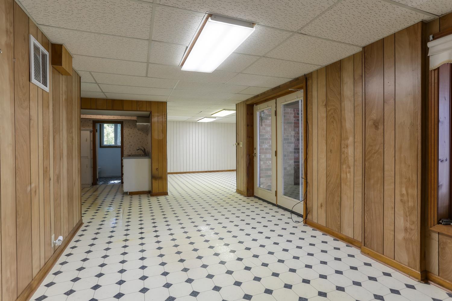2162 Liebengood Road Goodlettsville, TN 37072 - Photo 23 of 29 Finished Basement with full kitchen and bathroom. Could be utilized as In Law Quarters, Apartment or Bonus Area. French doors lead to covered patio.