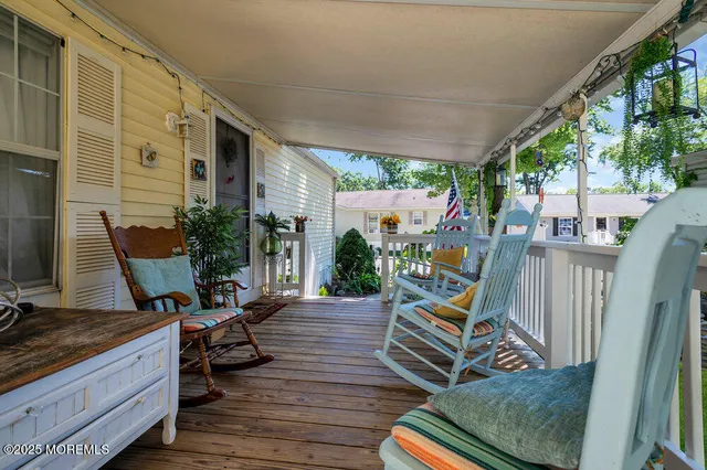 a view of a deck with furniture
