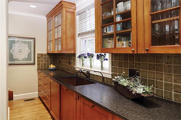 57 Hedge Road Brookline, MA 02445 - Photo 5 of 6 a kitchen with granite countertop a sink and a stove