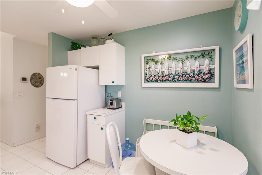 570 Windsor Square, Unit 202 Naples, FL 34104 - Photo 13 of 24 a white bath tub sitting next to a white toilet