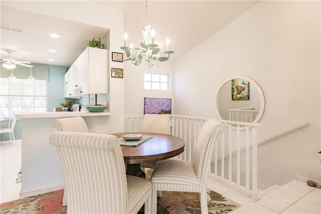 570 Windsor Square, Unit 202 Naples, FL 34104 - Photo 14 of 24 a view of a dining room with furniture