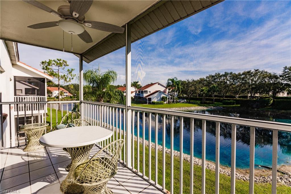 570 Windsor Square, Unit 202 Naples, FL 34104 - Photo 2 of 24 a view of a chairs and table in the balcony