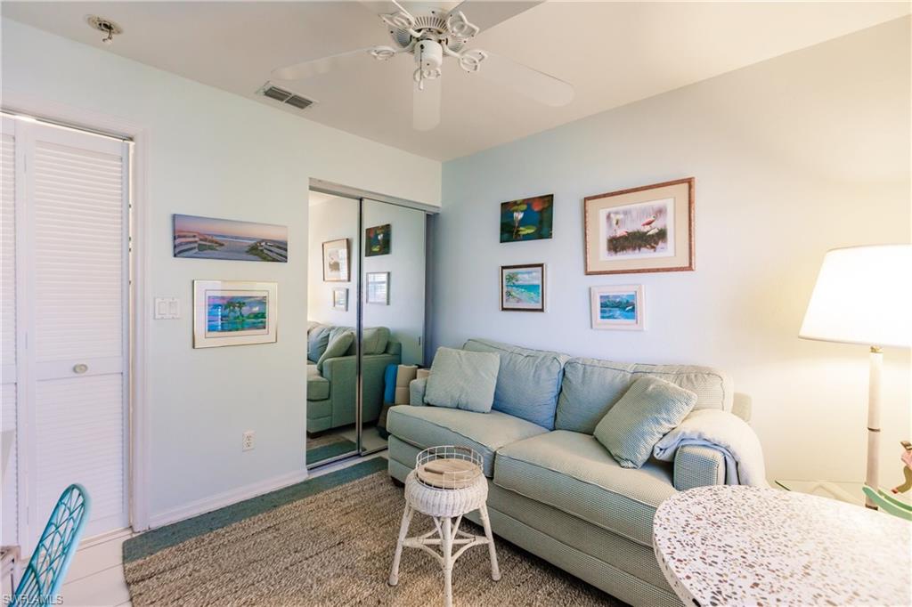 570 Windsor Square, Unit 202 Naples, FL 34104 - Photo 23 of 24 a living room with furniture and a rug