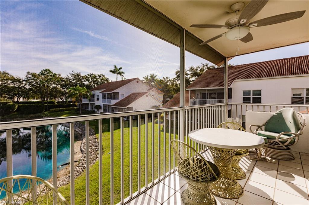 570 Windsor Square, Unit 202 Naples, FL 34104 - Photo 3 of 24 a view of a balcony with chairs