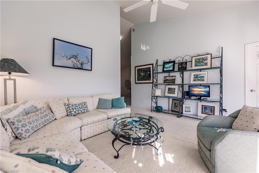 570 Windsor Square, Unit 202 Naples, FL 34104 - Photo 10 of 24 a living room with furniture and furniture