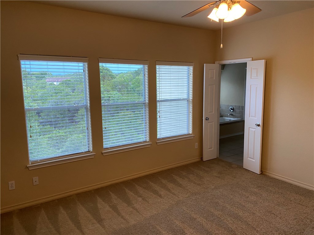 2670 Crazyhorse Pass Austin, TX 78734 - Photo 13 of 27 a view of an empty room with a window