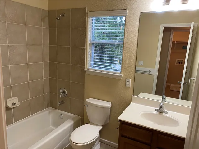 a view of a balcony next to a window