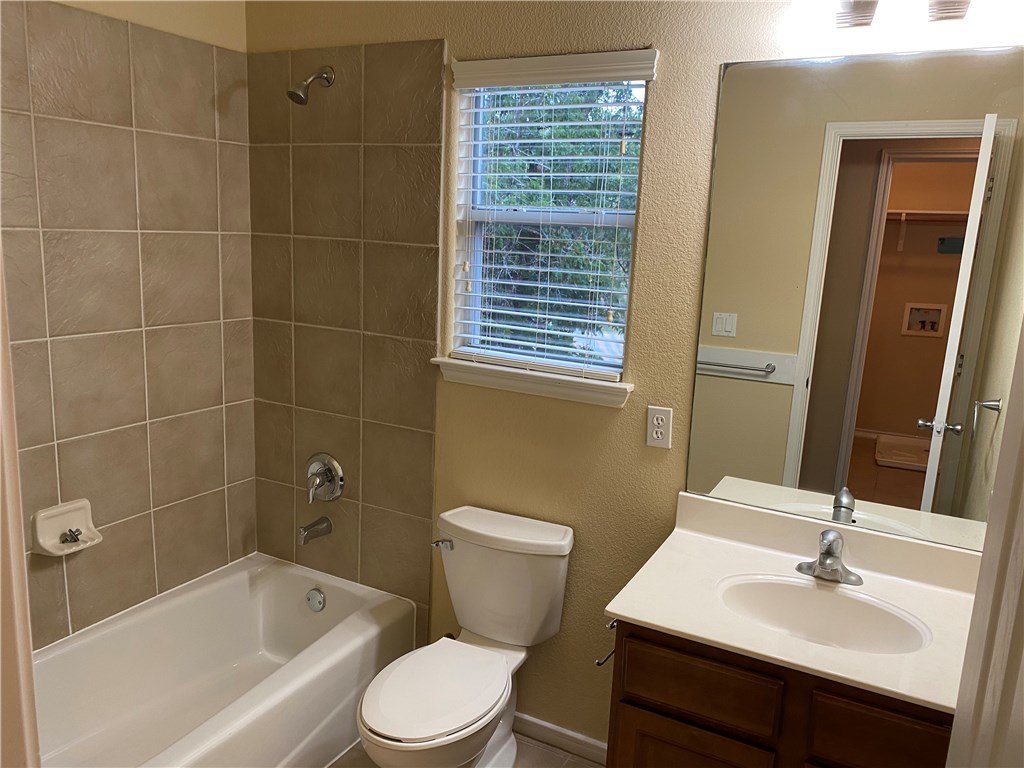2670 Crazyhorse Pass Austin, TX 78734 - Photo 18 of 27 a bathroom with a sink toilet and shower