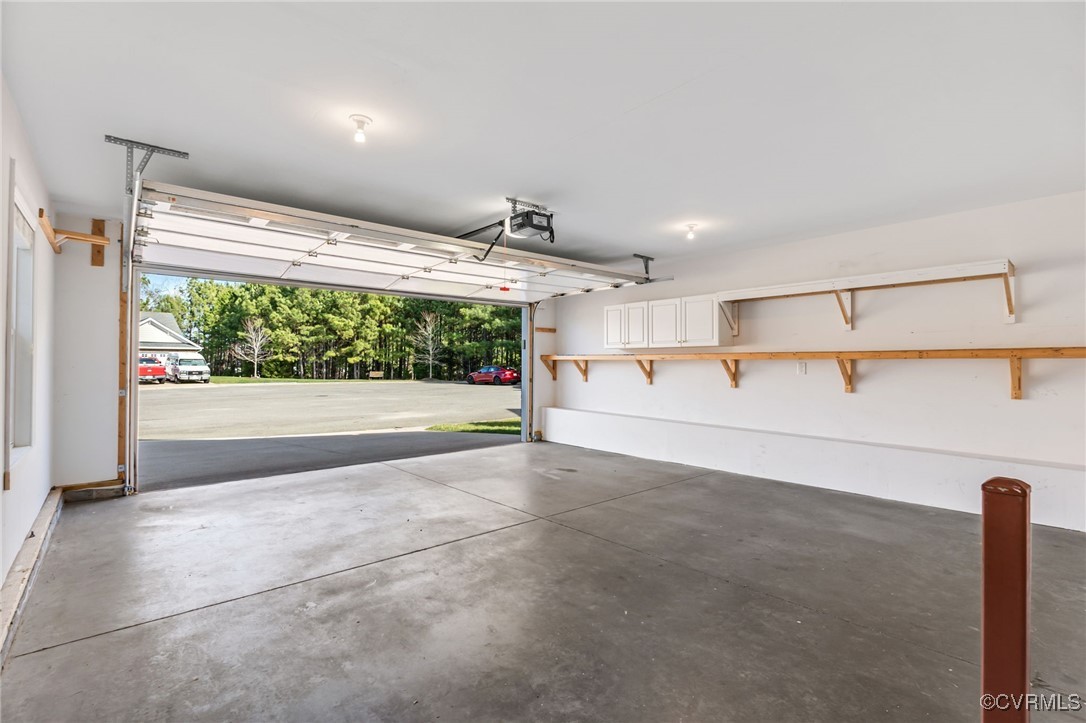4740 Kennington Park Road Aylett, VA 23009 - Photo 12 of 36 Garage with a garage door opener