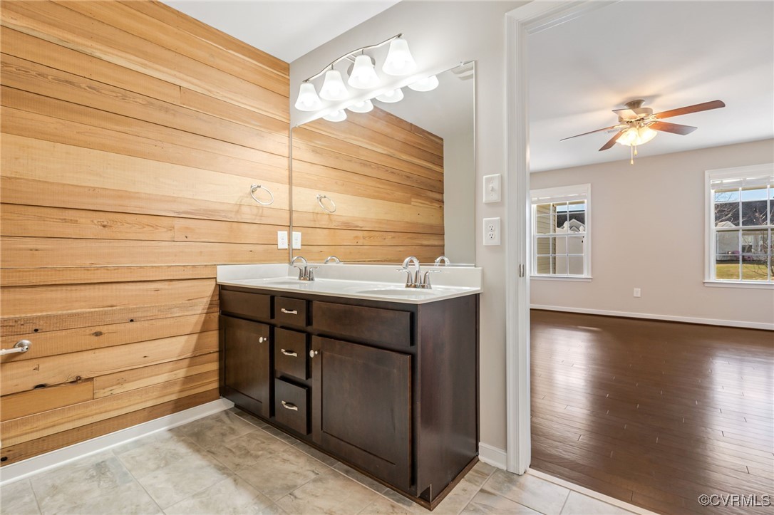 4740 Kennington Park Road Aylett, VA 23009 - Photo 26 of 36 Bathroom featuring wooden walls, vanity, and ceili
