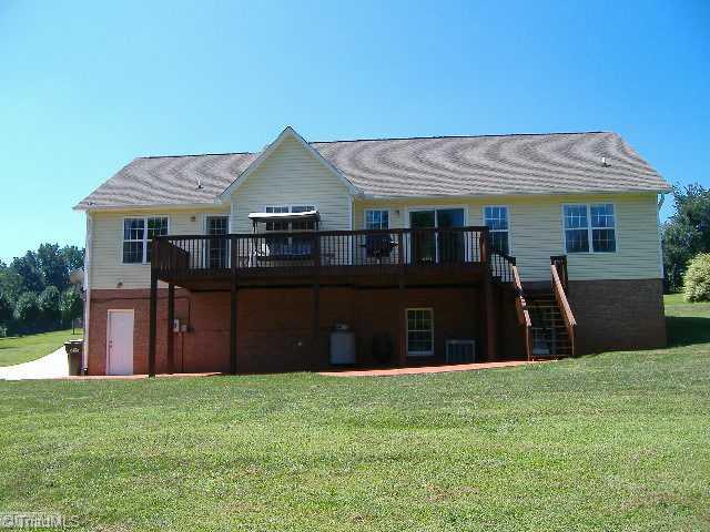 110 Hagen Road Advance, NC 27006 - Photo 14 of 16 Exterior Back. A Patio is under the deck. Great area for outdoor fun.