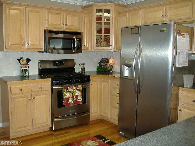 110 Hagen Road Advance, NC 27006 - Photo 5 of 16 Kitchen. Stainless Kitchen with Beautiful Cabnetry and Hardwoods. The Refrigerator is negotiable.