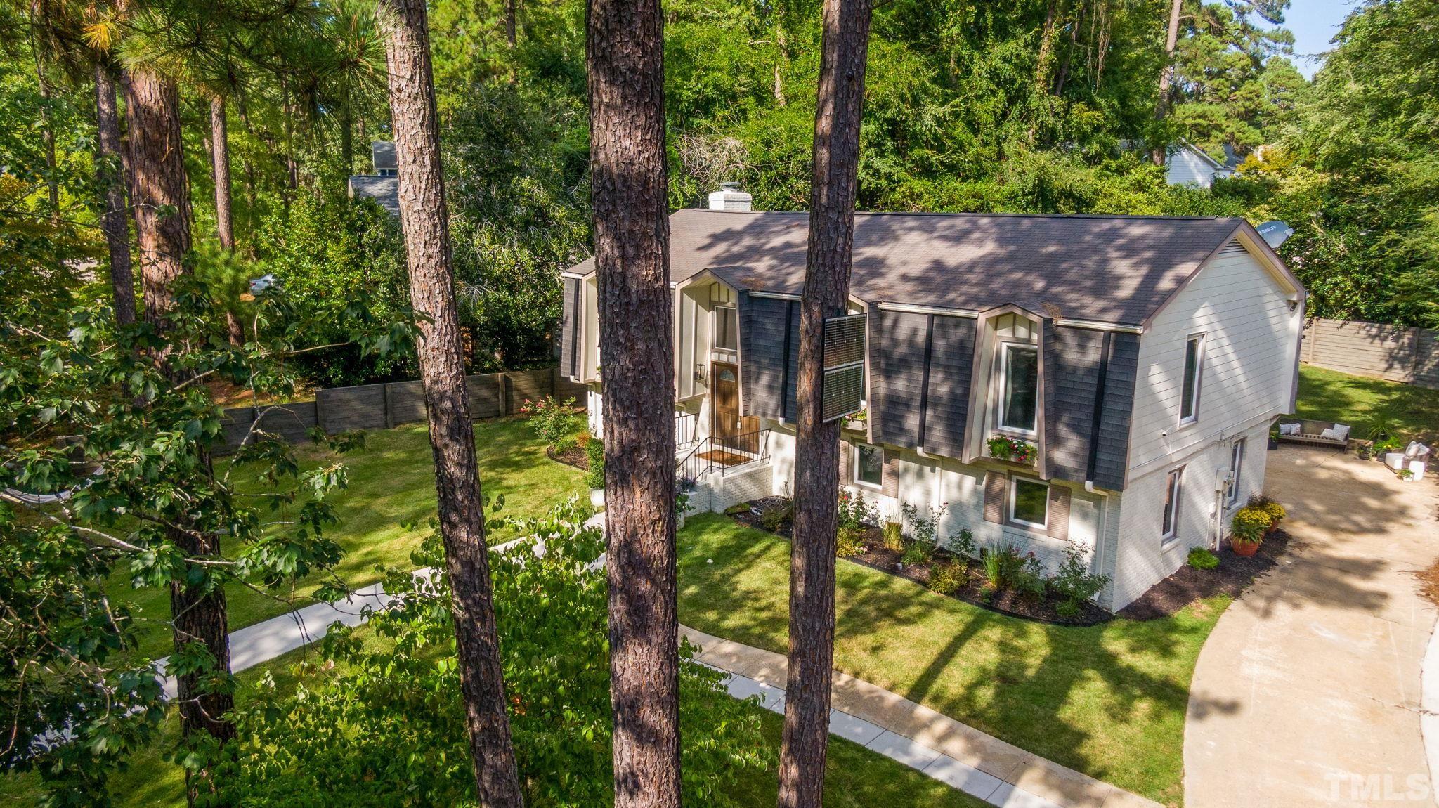5800 Timber Ridge Drive Raleigh, NC 27609 - Photo 3 of 67 a view of a house with a yard