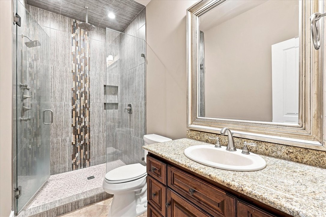 181 Sentell Road Williamston, SC 29697 - Photo 42 of 46 Lower level full bathroom. An elegant walk-in shower with floor-to-ceiling tiling highlights this well-appointed bathroom.