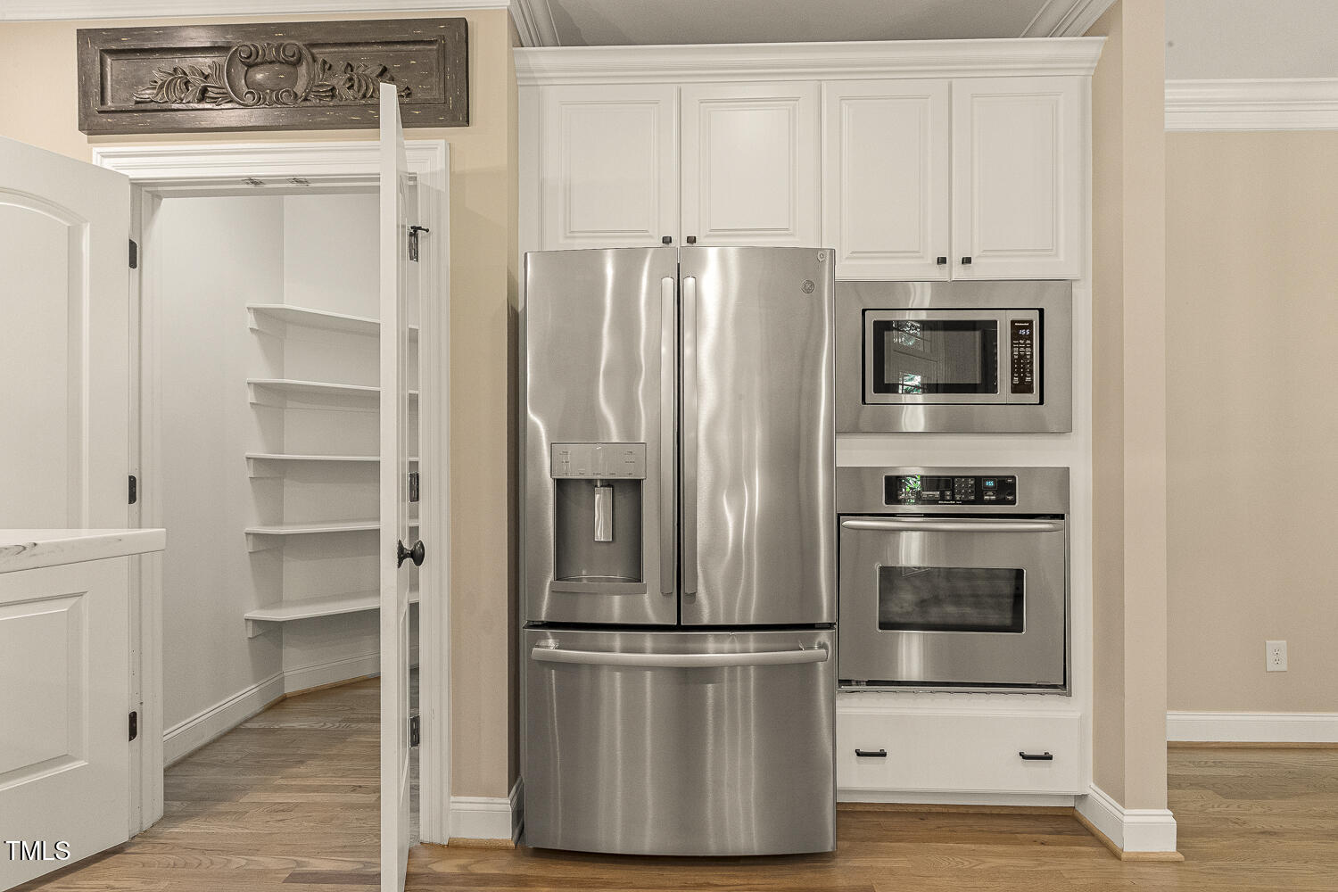 3124 Briar Stream Run Raleigh, NC 27612 - Photo 13 of 57 a kitchen with stainless steel appliances a refrigerator stove and microwave