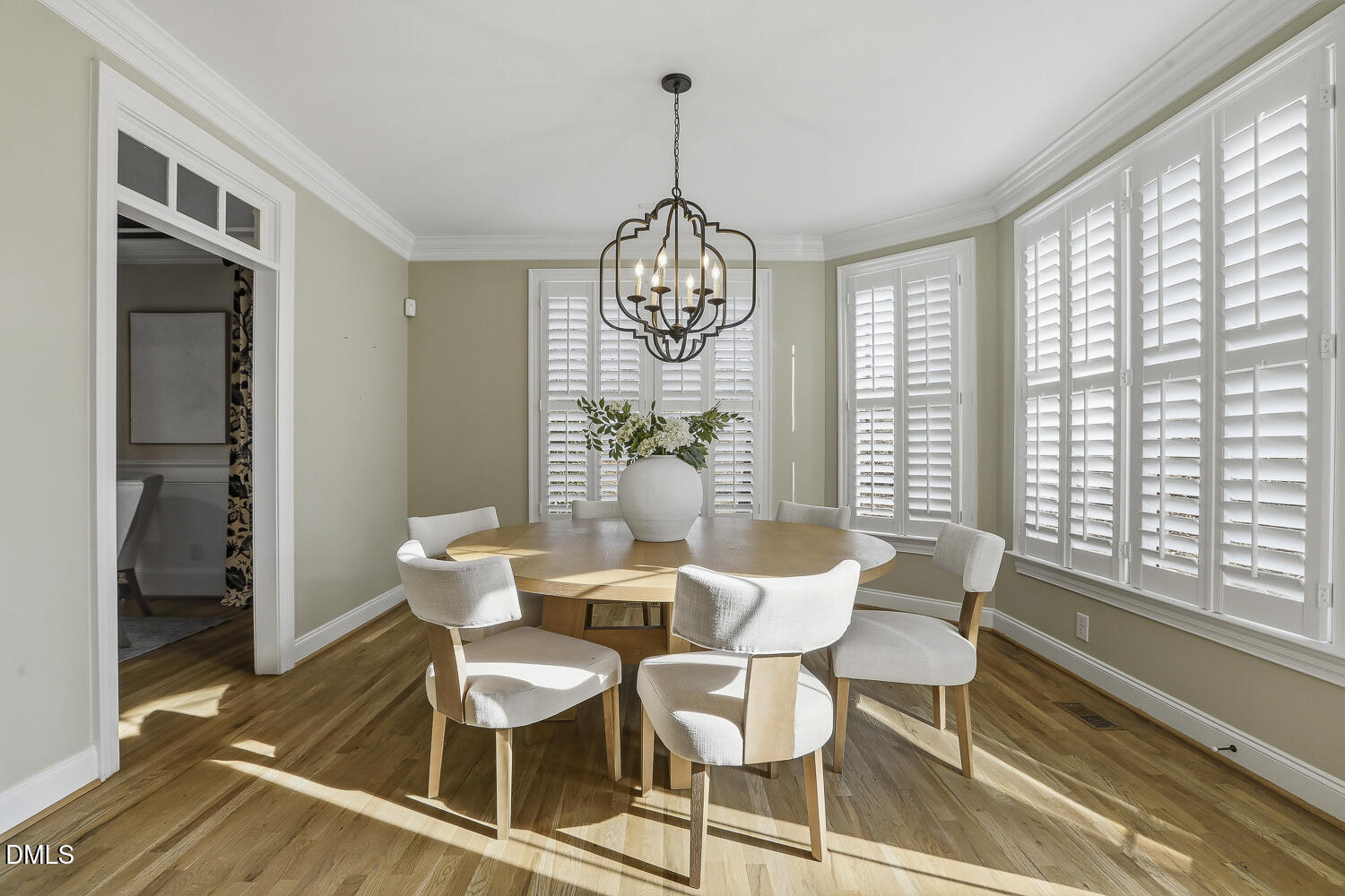 3124 Briar Stream Run Raleigh, NC 27612 - Photo 15 of 57 a dining room with furniture a chandelier and wooden floor