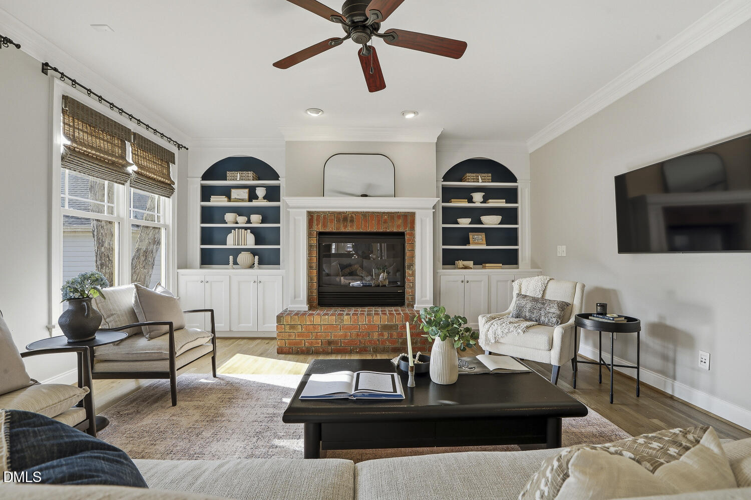 3124 Briar Stream Run Raleigh, NC 27612 - Photo 25 of 57 a living room with furniture a flat screen tv and a fireplace