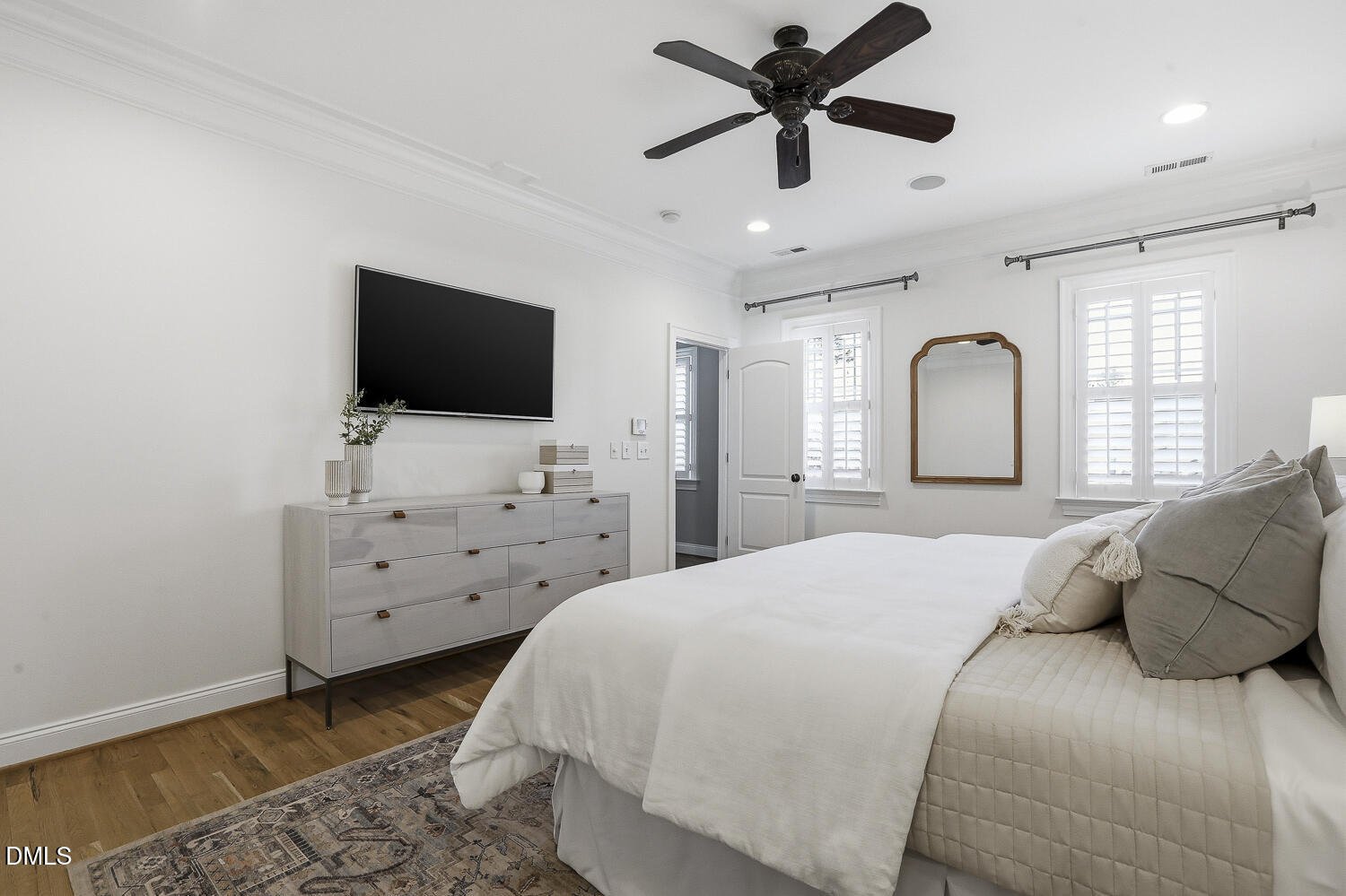 3124 Briar Stream Run Raleigh, NC 27612 - Photo 34 of 57 a bedroom with a bed and a flat screen tv