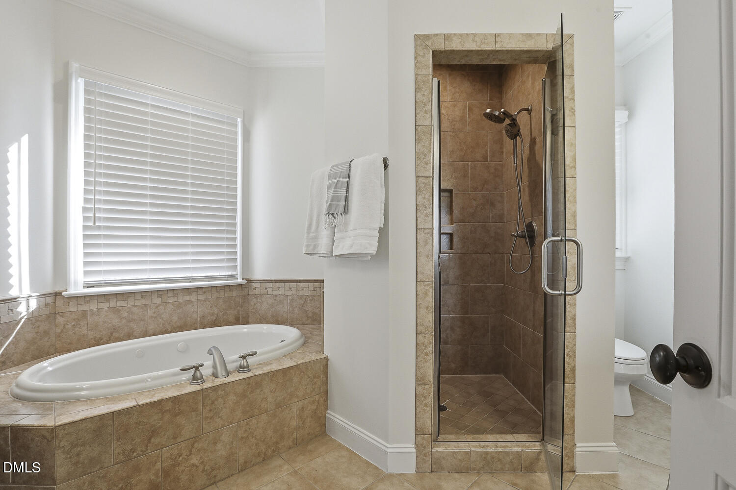 3124 Briar Stream Run Raleigh, NC 27612 - Photo 36 of 57 a bathroom with a bathtub and shower