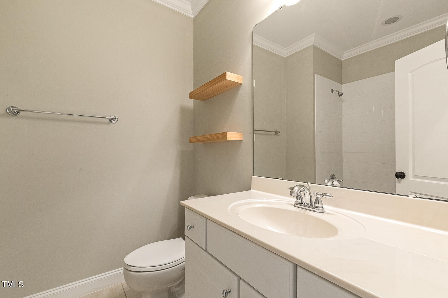 3124 Briar Stream Run Raleigh, NC 27612 - Photo 48 of 57 a bathroom with a sink toilet and vanity