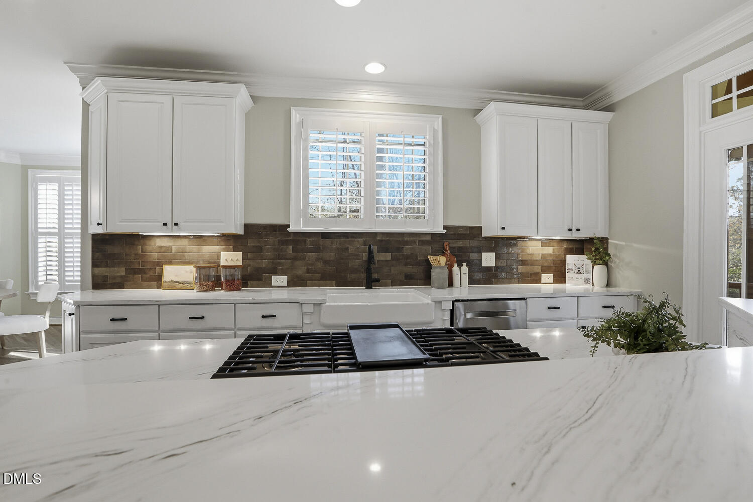 3124 Briar Stream Run Raleigh, NC 27612 - Photo 5 of 57 a kitchen with stainless steel appliances a stove a sink a refrigerator and cabinets